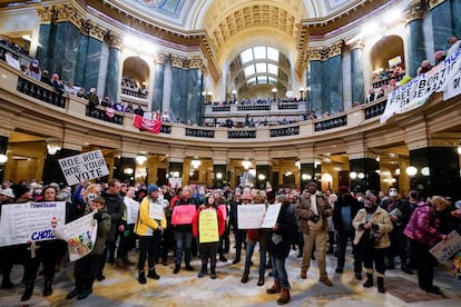 Protesters are seen in the Wisconsin Capitol Rotunda
