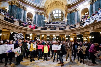 Protesters are seen in the Wisconsin Capitol Rotunda