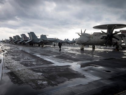 A naval officer walks on a deck at the aircraft carrier USS Harry S. Truman, near Split, Croatia, Monday, Feb. 14, 2022. USS Harry S. Truman aircraft carrier anchored off the coast of Split, after taking part in a 12-day NATO naval exercise in the Mediterranean that ended on Feb. 4. (AP Photo/Darko Bandic)