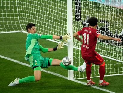 Thibaut Courtois, left, makes a save in front of Liverpool's Mohamed Salah