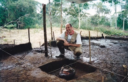 Archaeologist Stéphen Rostain poses next to a ceramic jar used for “chicha,” a traditional sweet corn beer, during an archaeological excavation in the Upano Valley.