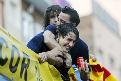 Puyol, Xavi y Bojan, durante la celebración.