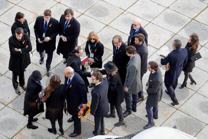 The Franco family is greeted by Santiago Cantera, the prior of the Basilica of the Valley of the Fallen, as they arrive for the exhumation of Franco.