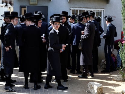 A group of ultra-Orthodox Israelis waiting to process their draft exemptions at the Kiryat Ono recruitment base last Thursday.