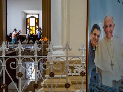A poster featuring Bishop Rolando Alvarez and Pope Francis hangs inside the Cathedral in Matagalpa, Nicaragua, Aug. 19, 2022.