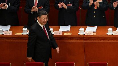 China's President Xi Jinping is applauded as he arrives for the opening session of the National People's Congress (NPC) at the Great Hall of the People in Beijing on March 5, 2023. (Photo by NOEL CELIS / AFP)