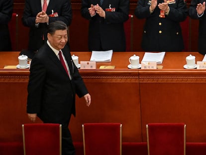 China's President Xi Jinping is applauded as he arrives for the opening session of the National People's Congress (NPC) at the Great Hall of the People in Beijing on March 5, 2023. (Photo by NOEL CELIS / AFP)