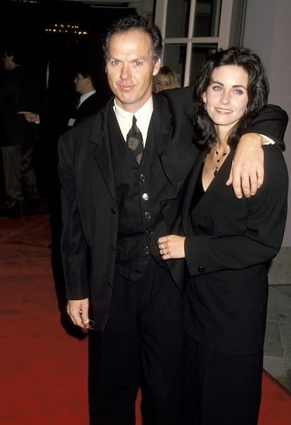 Michael Keaton and Courteney Cox pose during an NBC party.