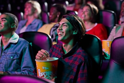 Happy audience watching movie in cinema hall