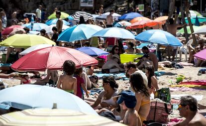 A busy beach on the Costa Brava.