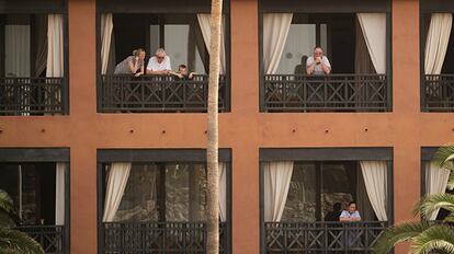 Guests on their balconies at the H10 Costa Adeje Palace hotel in the Canary Island of Tenerife.