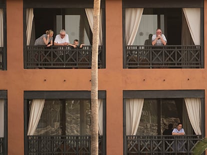 Guests on their balconies at the H10 Costa Adeje Palace hotel in the Canary Island of Tenerife.