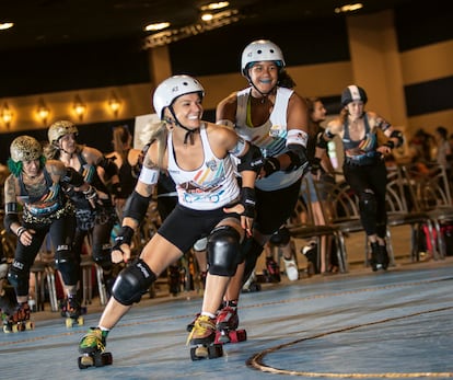 Nele van Bogaert (left), a roller skater on the London Roller Derby and the Belgian national team, as well as the founder of Skating, a skating center in London.