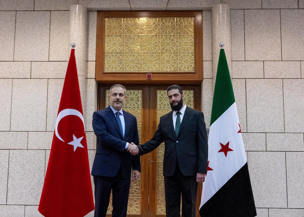 Turkey's Foreign Minister Hakan Fidan meets with Syria's de facto leader Ahmed al-Sharaa, also known as Abu Mohammed al-Golani, in Damascus, Syria, December 22, 2024. Turkish Foreign Ministry/Handout via REUTERS ATTENTION EDITORS - THIS PICTURE WAS PROVIDED BY A THIRD PARTY. NO RESALES. NO ARCHIVES.     TPX IMAGES OF THE DAY