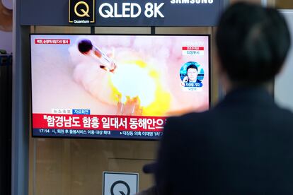 People watches a TV screen reporting North Korea's missile launch with file image during a news program at the Seoul Railway Station in Seoul, South Korea, Wednesday, March 22, 2023.