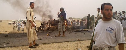 Security guards at the site of the attack against a tourist convoy in 2007.