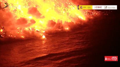 Steam rises as lava from the Cumbre Vieja volcano reaches the Atlantic Ocean off the island of La Palma on September 29, in an image captured by the Geological and Mining Institute of Spain. 