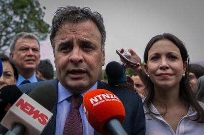 Brazilian Senator Aécio Neves and Venezuelan opposition leader María Corina Machado speak to reporters in Caracas on Thursday.