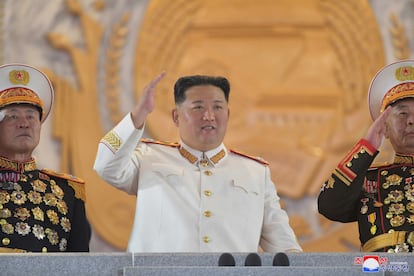 North Korea's Supreme Leader Kim Jong-un in a marshal's uniform salutes during Sunday's military parade