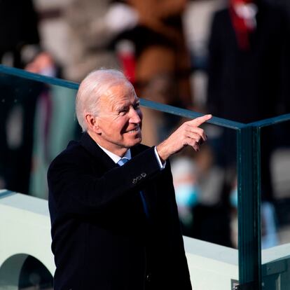 President Joe Biden points to guests attending after the 59th presidential inauguration of US President-elect Joe Biden on the West Front of the US Capitol on January 20, 2021 in Washington, DC. - During today's inauguration ceremony Joe Biden becomes the 46th president of the United States. (Photo by Caroline Brehman / POOL / AFP)