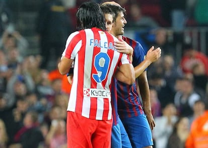 Leo Messi and Radamel Falcao embrace after a league match between Atlético and Barcelona.
