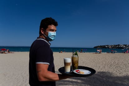 A waiter in Palmanova beach in Calvía in the Balearic island of Mallorca.