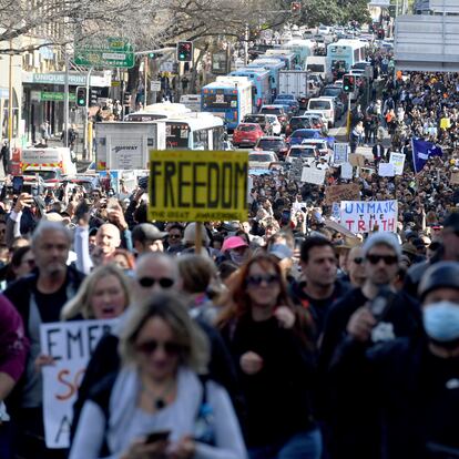 Protesters march through the streets during a 'World Wide Rally For Freedom' anti-lockdown rally in Sydney, Saturday, July 24, 2021. (Mick Tsikas/AAP Image via AP)