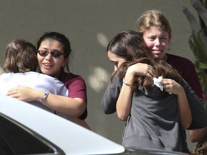 Students from Parkland hug one another after the school shooting.