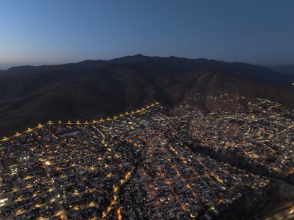 Twilight in the mountains of California, separated from Tijuana (Mexico) by the illuminated wall.