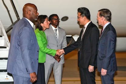 US Secretary of Commerce Gina Raimondo (2-L) shakes hands with China's Ministry of Commerce Director General Lin Feng (2-R), next to U.S. Ambassador to China Nicholas Burns (R), as she arrives at the Beijing Capital International Airport in Beijing, China, 27 August 2023.