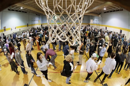 People wait to vote on Super Tuesday in the gymnasium at Cleveland Park Community Center, Tuesday, March 3, 2020, in Nashville, Tenn.