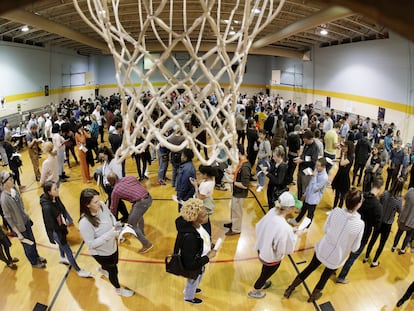 People wait to vote on Super Tuesday in the gymnasium at Cleveland Park Community Center, Tuesday, March 3, 2020, in Nashville, Tenn.