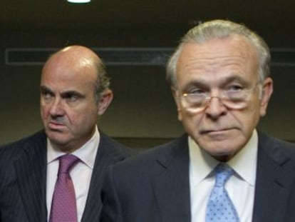 Fain&eacute; (d), presidente de La Caixa y CaixaBank, con Guindos.