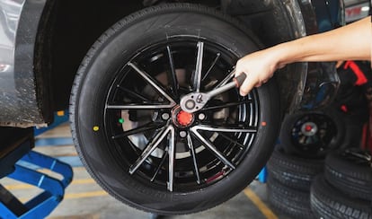 A mechanic working on a tire.