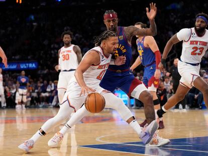 New York Knicks guard Jalen Brunson (11) drives against Denver Nuggets guard Kentavious Caldwell-Pope (5) during the second half of an NBA basketball game, Saturday, March 18, 2023, at Madison Square Garden in New York.