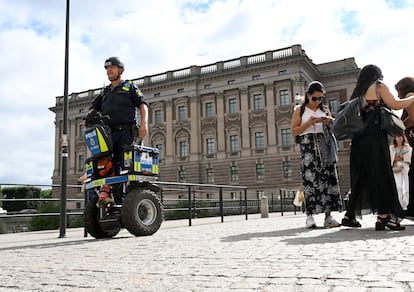 A police officer on a Segway patrols Sweden's parliament Riksdagen as the terror threat level in Sweden is raised to four on a five-point scale, in Stockholm, Sweden, August 17, 2023.