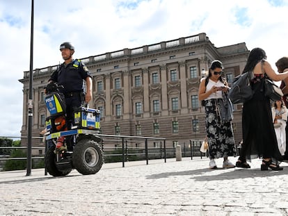 A police officer on a Segway patrols Sweden's parliament Riksdagen as the terror threat level in Sweden is raised to four on a five-point scale, in Stockholm, Sweden, August 17, 2023.