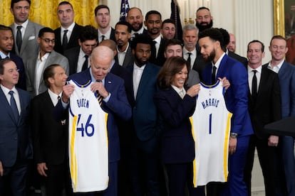 President Joe Biden and Vice President Kamala Harris hold up team jerseys as they welcome the 2022 NBA champions, the Golden State Warriors, to the East Room of the White House in Washington, Tuesday, Jan 17, 2023.