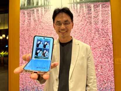 Junho Jeong shows off the photo booth pictures he took with his daughter.