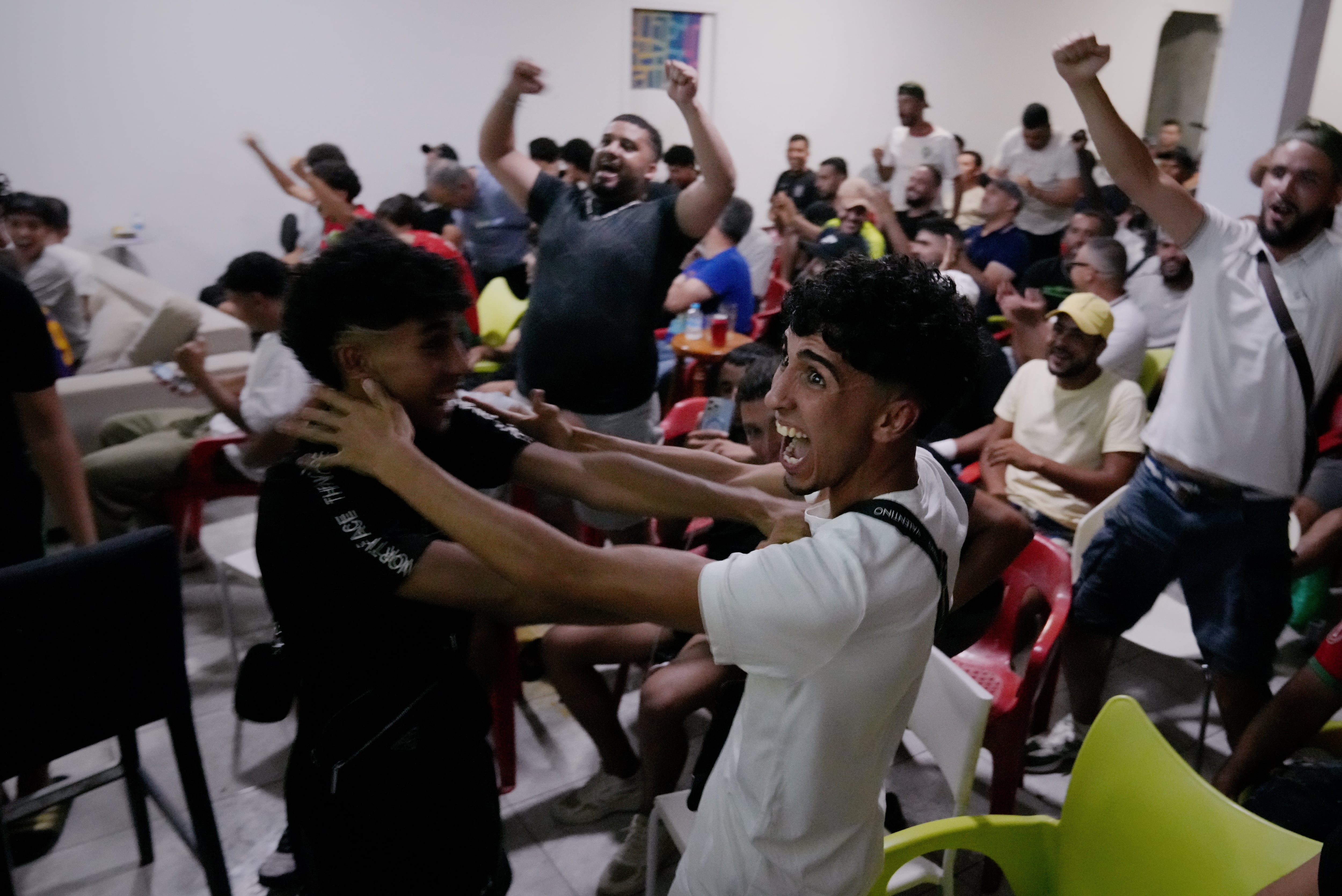 Several residents of Torre Pacheco watch Morocco's game against France on Thursday.