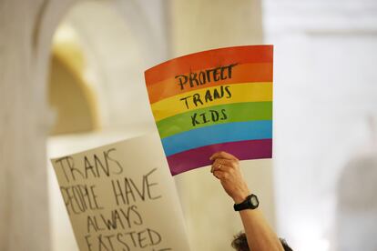 Protestors hold signs during a rally opposing HB2007 at the state capitol in Charleston, W.Va., on March 9, 2023