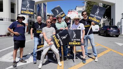 Cast and writers from "Breaking Bad" and "Better Call Saul" Juan Carlos Cantu, from left, Javier Grajeda, Aaron Paul, Charles Baker, Norma Maldonad, Jesse Plemons, Peter Gould, Bryan Cranston and Matt Jones, pose on a picket line outside Sony Pictures studios on Tuesday, Aug. 29, 2023, in Culver City, Calif.