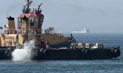 A Gibraltarian tug dumps concrete slabs into the water close to the colony&#039;s airport last month.