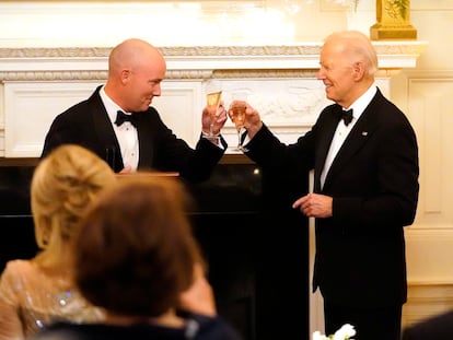 Utah Gov. Spencer Cox, left, and President Joe Biden toast before Biden speaks to members of the National Governors Association during an event in the State Dining Room of the White House in Washington, Saturday, Feb. 24, 2024.