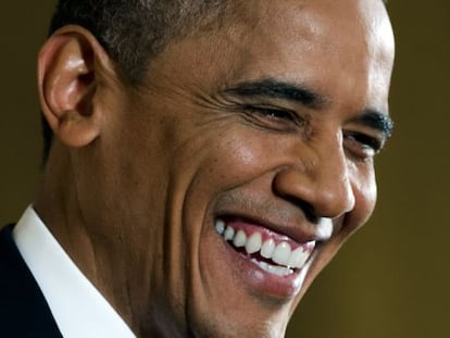 Obama sonríe durante la comparecencia en la Casa Blanca.
