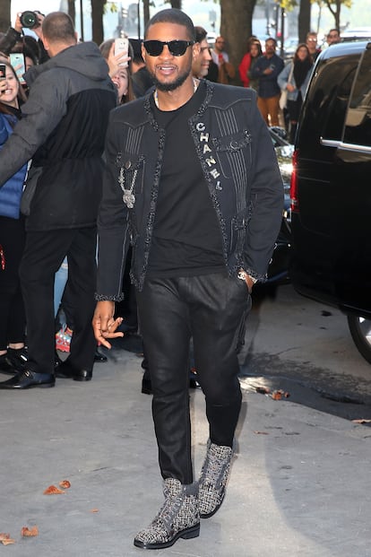 Usher arrives at the Chanel show