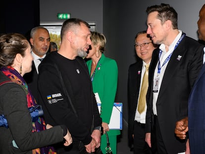 Ukraine's Deputy Minister for Digital Transformation Georgii Dubynskyi speaks with Elon Musk on day one of the AI Safety Summit at Bletchley Park in Bletchley, Britain on November 1, 2023.