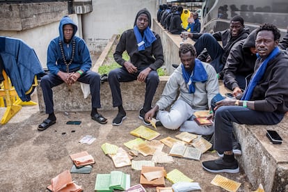 Migrants temporarily housed in a sports center in the town of San Andrés, in El Hierro, wait to be transferred to the island of Tenerife.