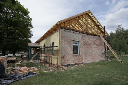 Repair works being done to the cultural center of the town of Olyva, in northern Ukraine. The building was damaged by missiles and artillery fire. 

