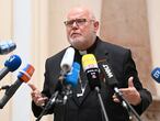 Cardinal Reinhard Marx (L), Archbishop of Munich and Freising, addresses a press conference in Munich, southern Germany, on June 4, 2021, after he had offered Pope Francis his resignation over the church's "institutional and systemic failure" in its handling of child sex abuse scandals. - "It is important to me to share the responsibility for the catastrophe of the sexual abuse by Church officials over the past decades," said Marx in a letter to the pope dated May 21, 2021 and published on June 4 by his archdiocese in Munich. (Photo by LENNART PREISS / AFP)